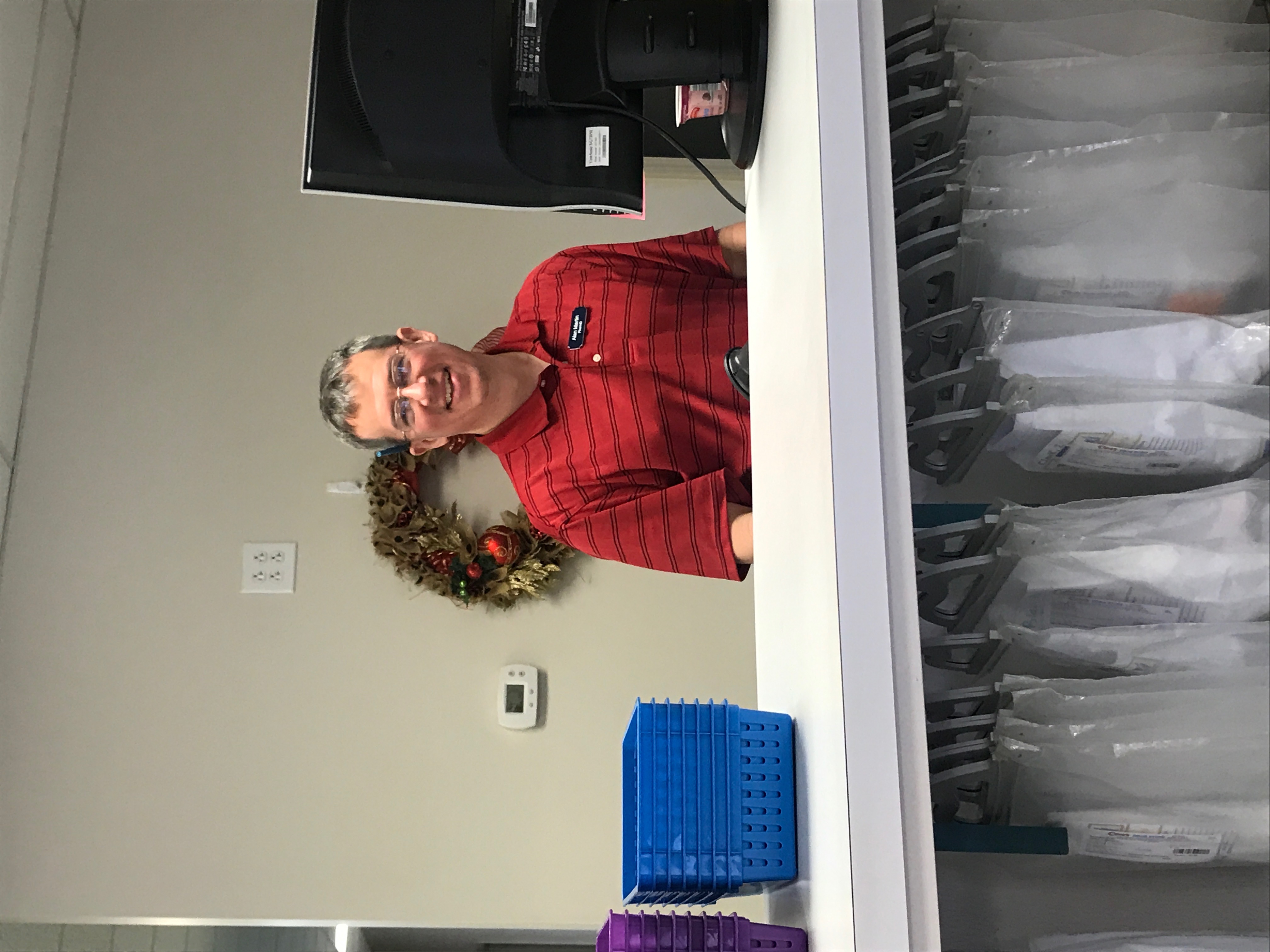 Alan Martin behind the pharmacy counter
